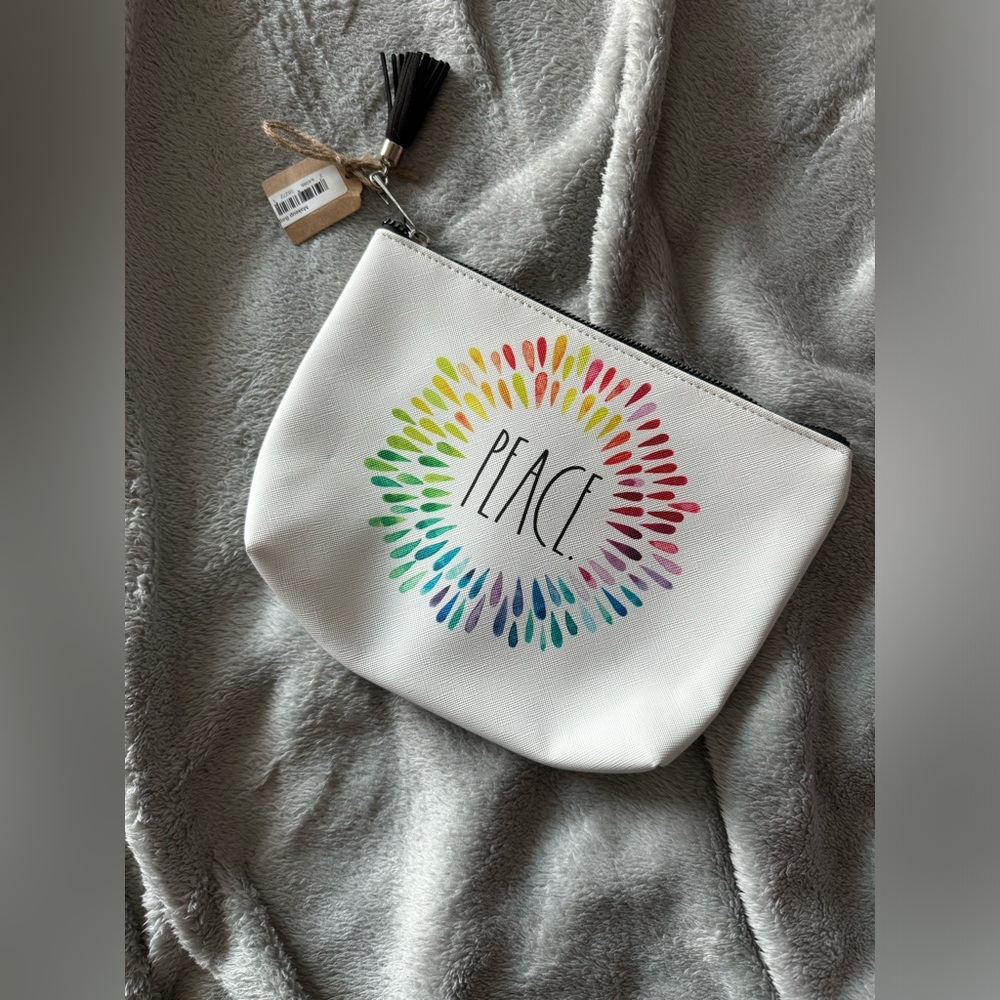NWT Rae Dunn Peace makeup bag. Made with PVC and polyester.